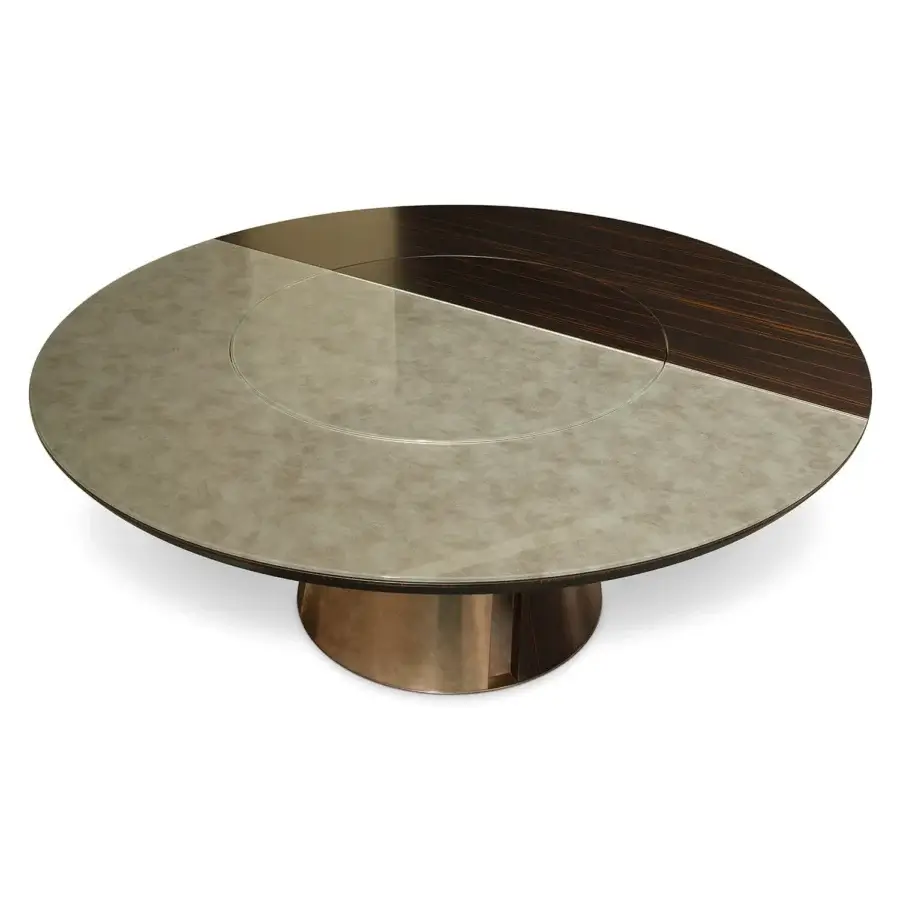 Exceptional Sicis Osas table with polished Amara ebony base, champagne metal frame, revolving Vetrite glass, and mottled stone-like wood surface