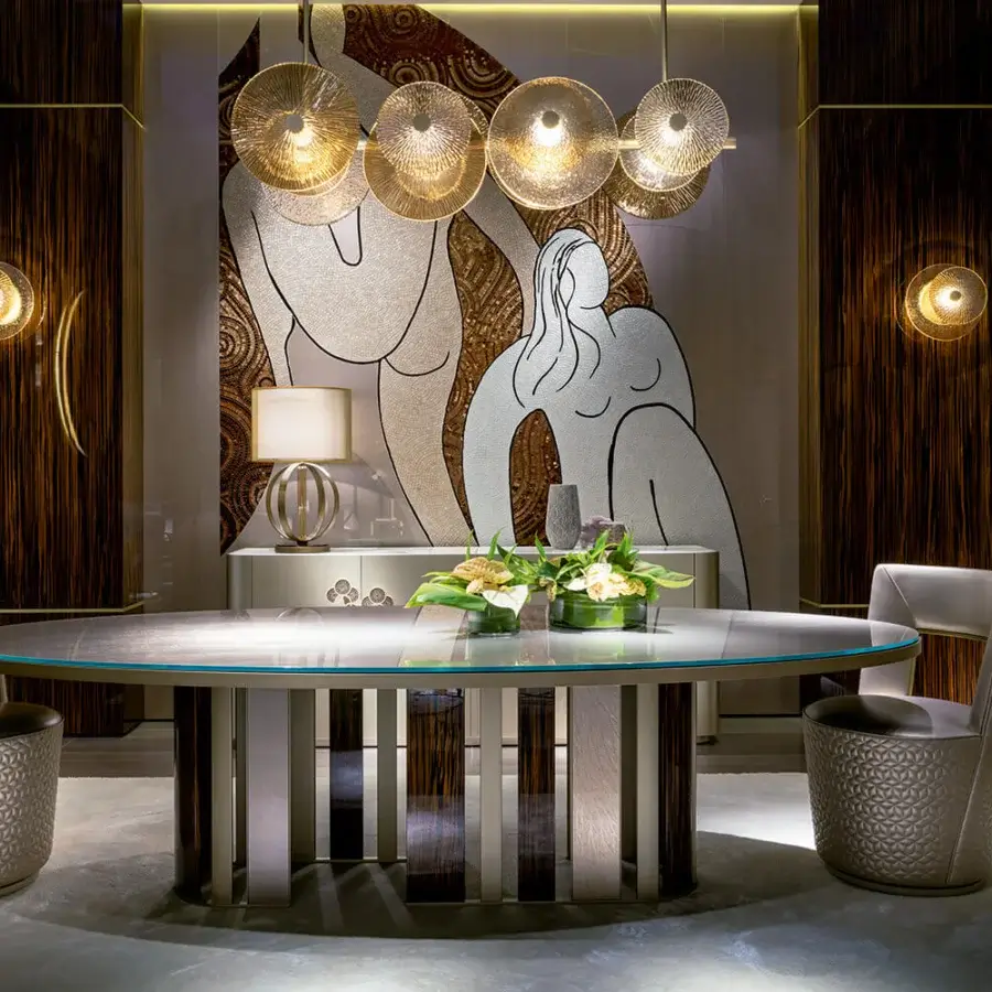 Elegant Sicis Koro table with oval glass top and striking circular metal with ebony base in satin finish