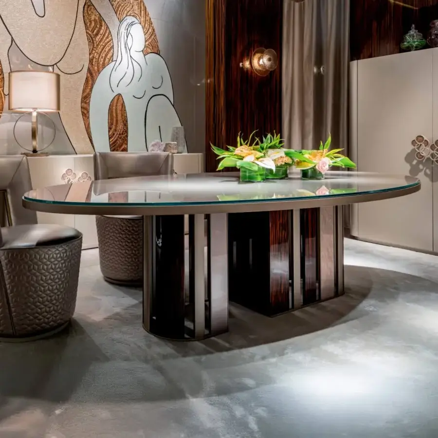 Captivating Sicis Koro table with oval glass top and dynamic circular ebony and metal slat base with glossy finish
