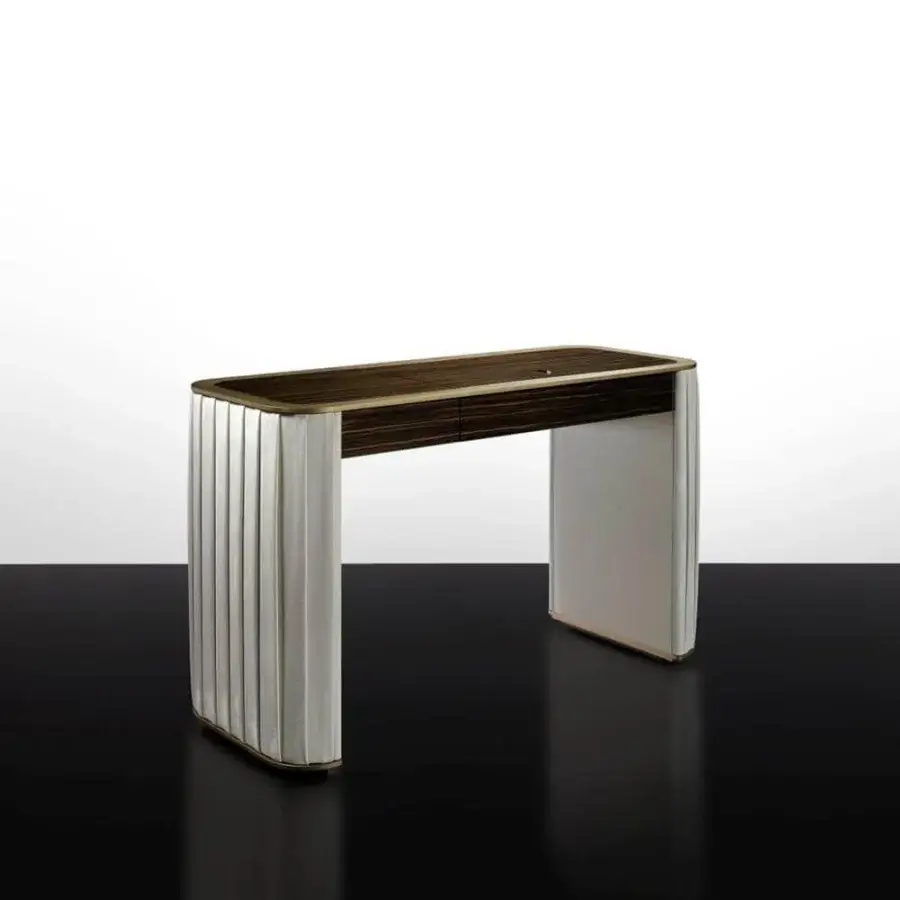 Distinguished Reflex Plissé vanity with ebony wood and white pleated fabric, highlighted with satin brass detail