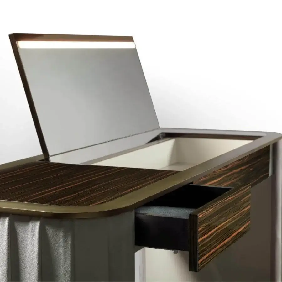 Superior Reflex Plissé vanity with ebony wood structure, pleated sides and integrated lighting in a satin brass accent