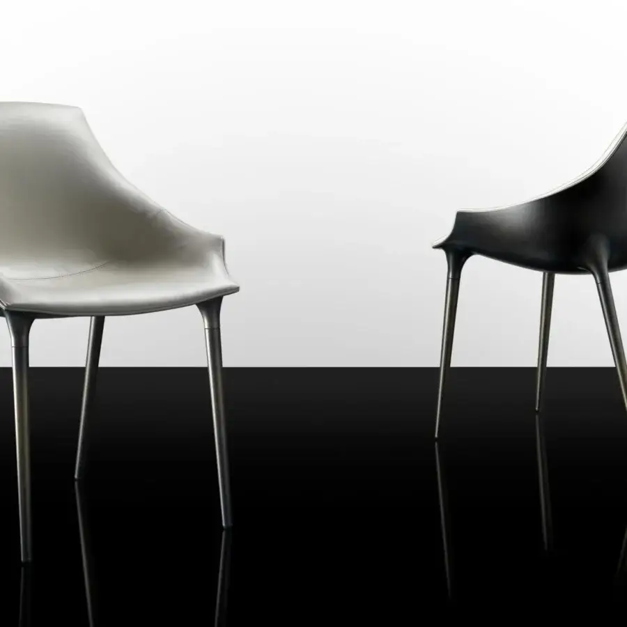 Exclusive Reflex Milady chair with Nero Beluga finish, light gray leather seat and emerald quilting details