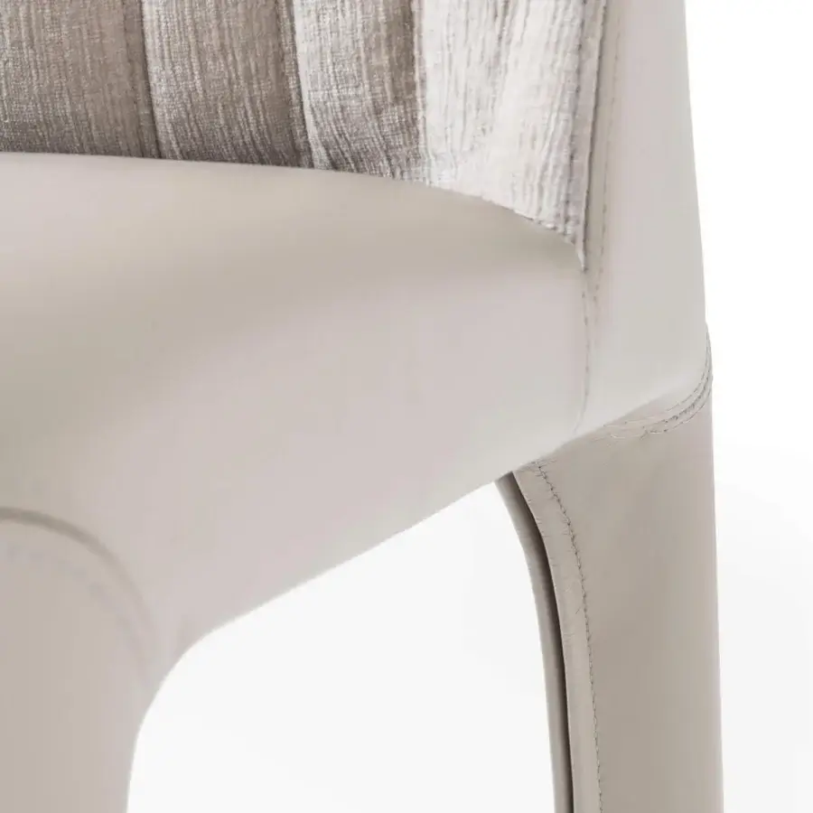Exceptional Giorgetti Bicolette chair with vertical stitching and a pale beige refined fabric finish for transitional dining spaces