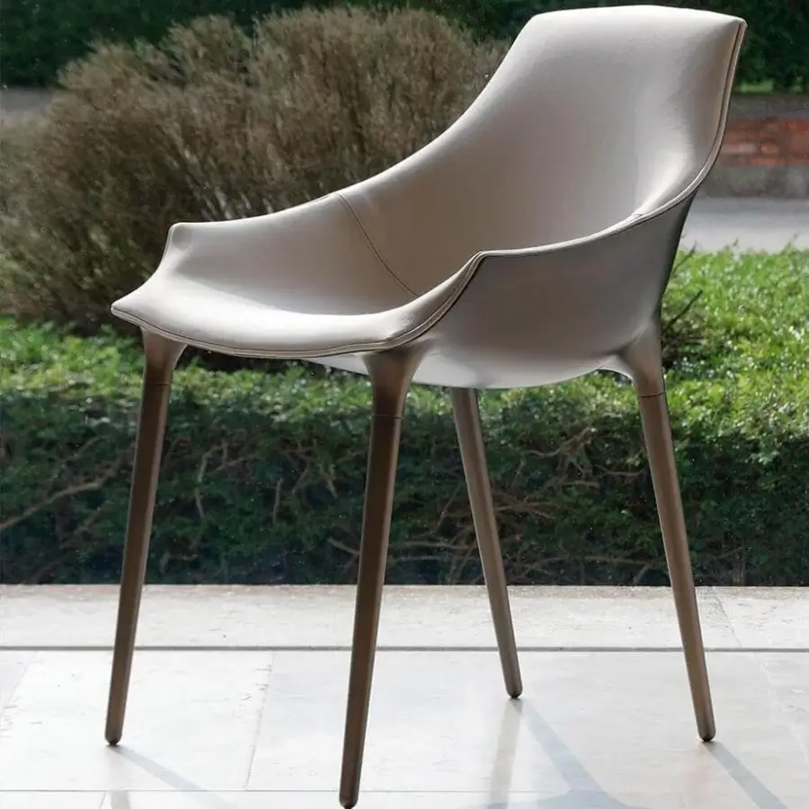 Distinguished Reflex Milady chair with neutral gray-beige leather upholstery and bronze finished legs
