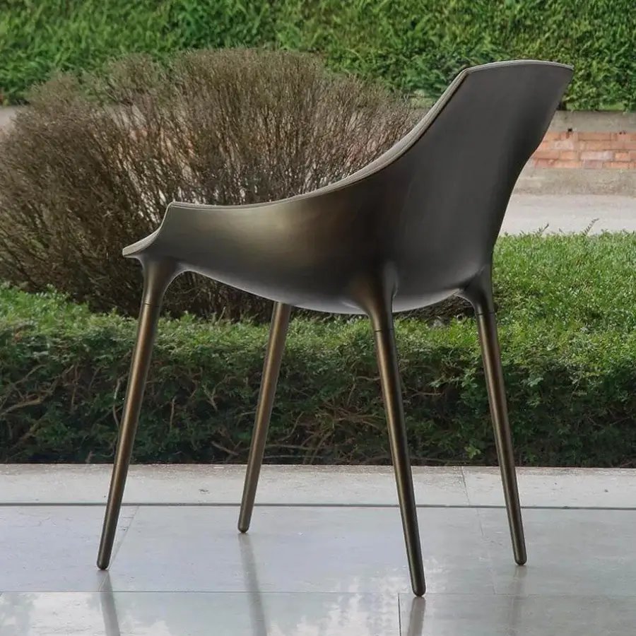 Exceptional Reflex Milady chair crafted from polypropylene with a bronze finish and plush leather seat with matching piping