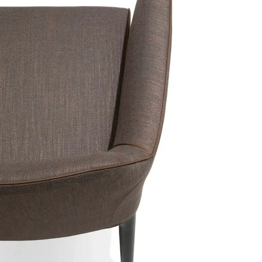 Sophisticated Giorgetti Alina armchair upholstered in warm brown woven textile with stylish leather piping