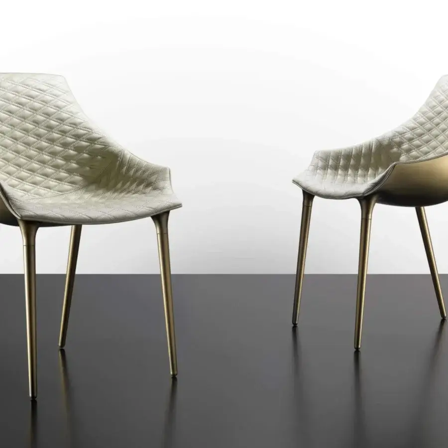 Refined Reflex Milady chair with light cream textile upholstery and bronze polypropylene frame exhibiting Emerald quilting
