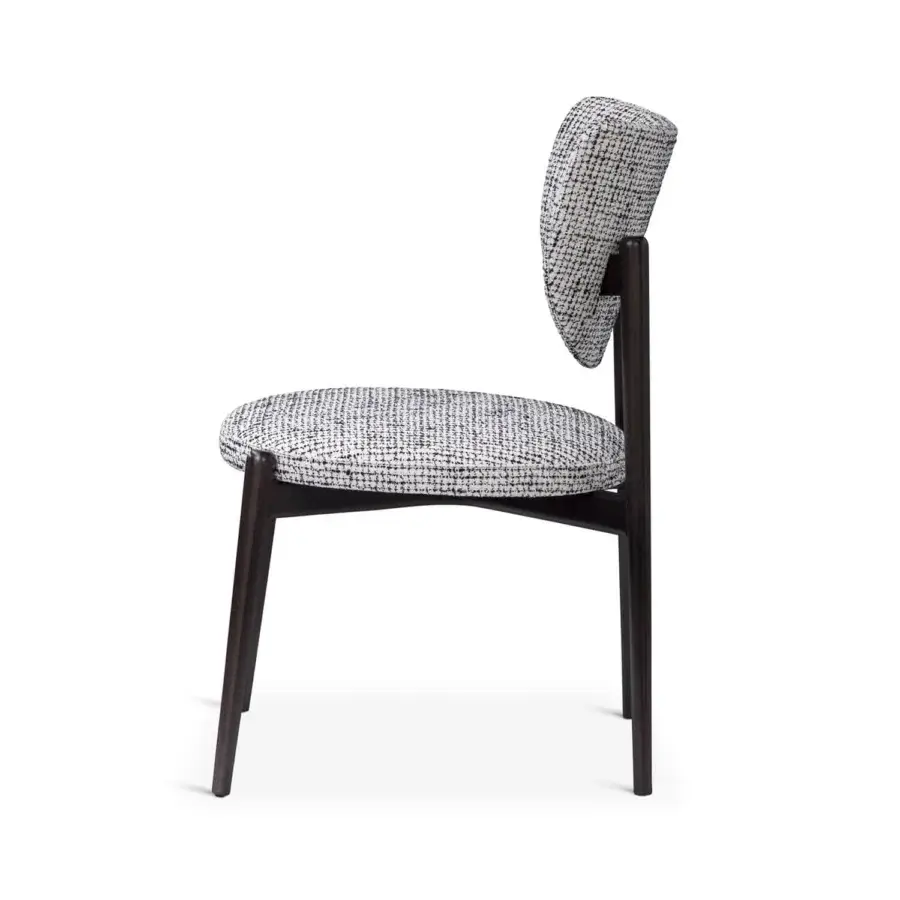 Elegant Sicis Thea chair with a gracefully curved silhouette fully upholstered in textured black and white textile with a solid wood frame
