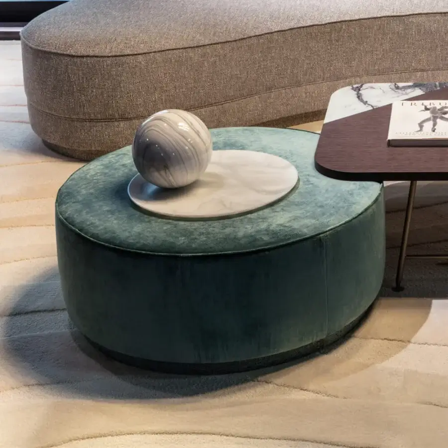 Exceptional Sicis Chamaleon low round ottoman with sumptuous matte velvet textile upholstery and marble accent