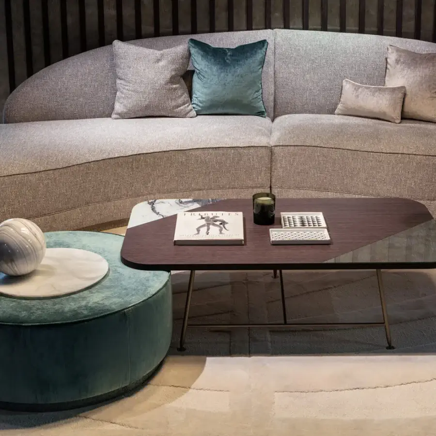 Superior Sicis Chamaleon low round ottoman crafted in Italy with grayish-green textured fabric upholstery