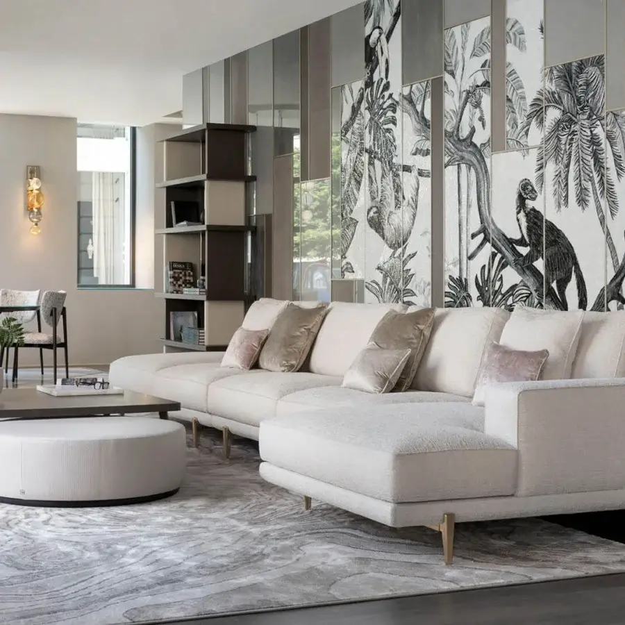 Refined Sicis Chamaleon low round ottoman crafted in Italy with textured fabric and matte finish