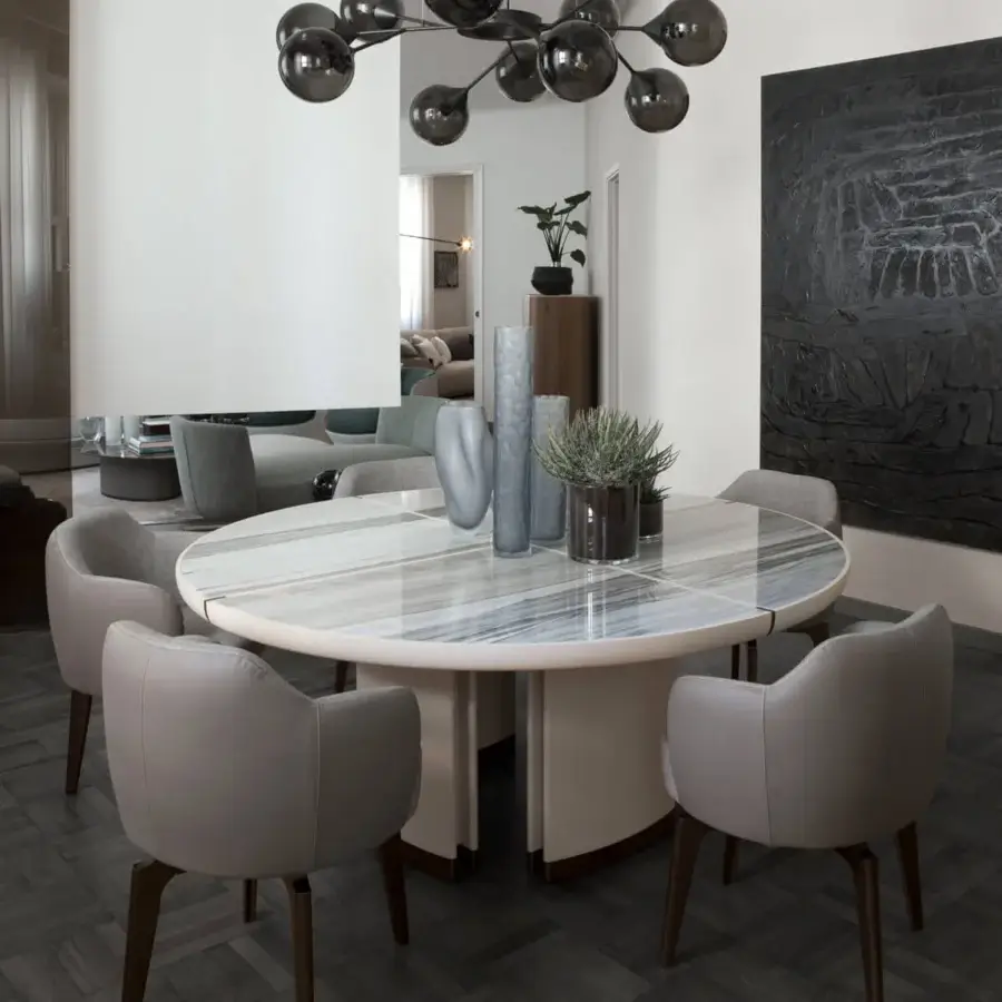 Captivating Giorgetti Elisa armchair upholstered in smooth gray fabric with a walnut Canaletto swivel base and matte finish