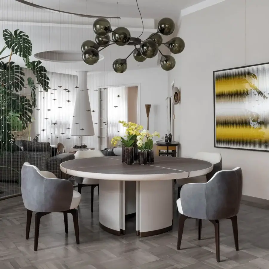 Elegant Giorgetti Elisa armchair upholstered in muted gray fabric with a walnut Canaletto swivel base