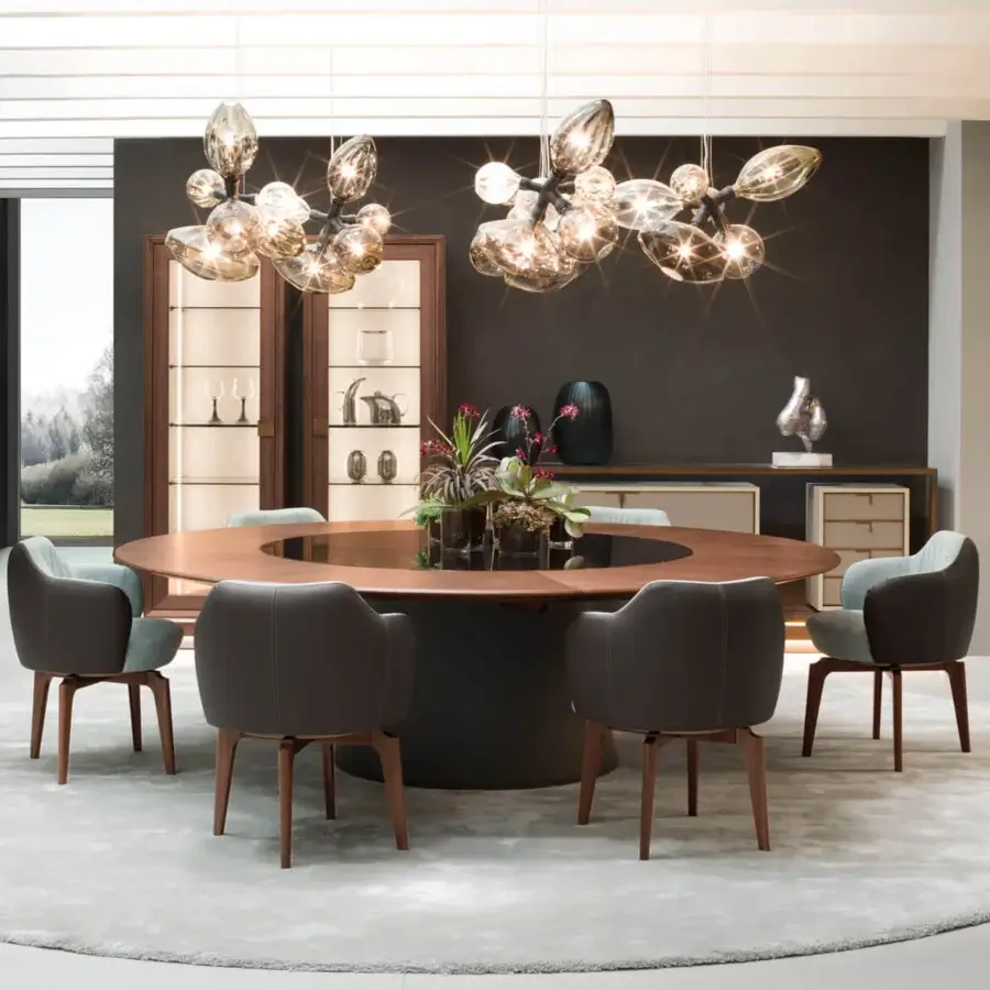 Captivating Giorgetti Elisa armchair upholstered in muted gray fabric with a walnut Canaletto swivel base and light teal legs