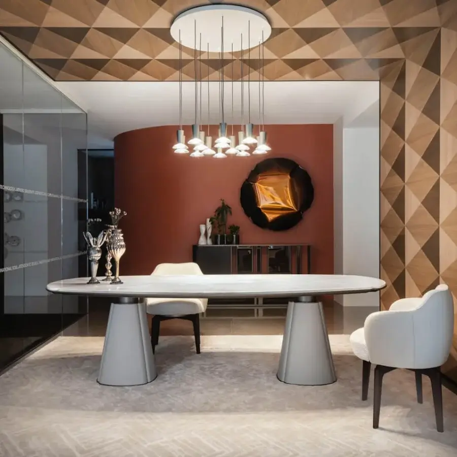Distinguished Giorgetti Elisa armchair upholstered in light gray fabric with a sleek matte bronze swivel base