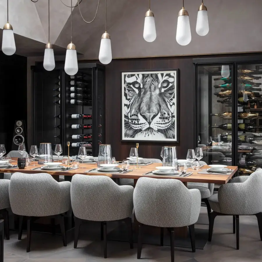 Captivating Giorgetti Elisa armchair upholstered in textured gray fabric with a walnut Canaletto swivel base crafted in Italy