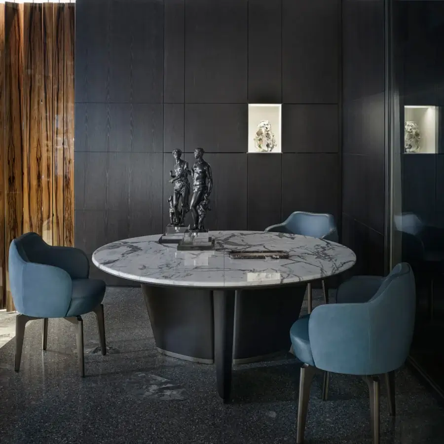 Distinguished Giorgetti Elisa armchair upholstered in smooth matte teal fabric with a satin-finish walnut Canaletto swivel base