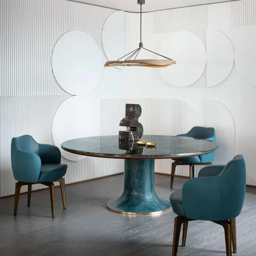 Captivating Giorgetti Elisa armchair upholstered in muted teal fabric with a satin brass swivel base