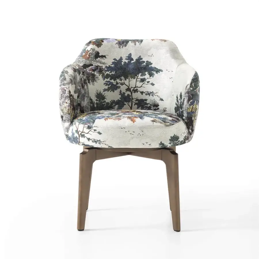 Elegant Giorgetti Elisa armchair with walnut Canaletto swivel base and off-white fabric displaying a landscape pattern in green, blue, and brown hues