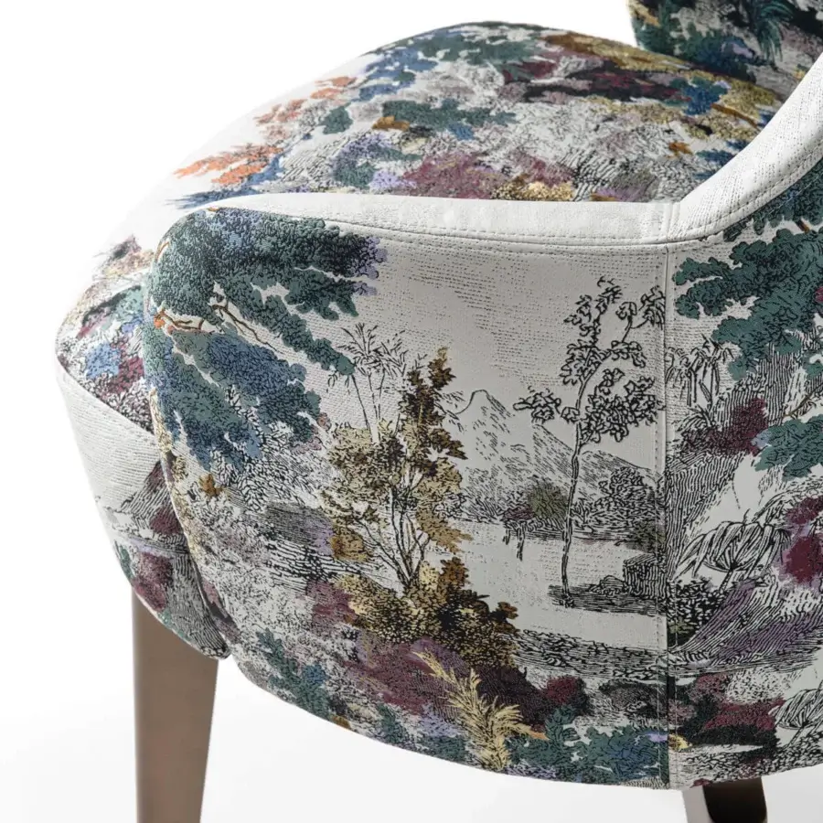 Captivating Giorgetti Elisa armchair in muted cream fabric with green, blue, purple, and ochre landscape print and walnut Canaletto swivel base