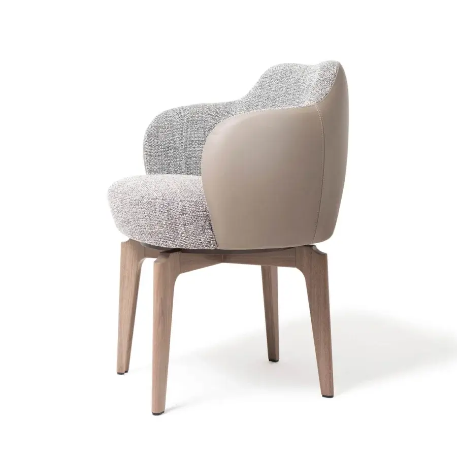 Distinguished Giorgetti Elisa armchair with gracefully curved form in textured fabric and smooth leather with walnut Canaletto swivel base
