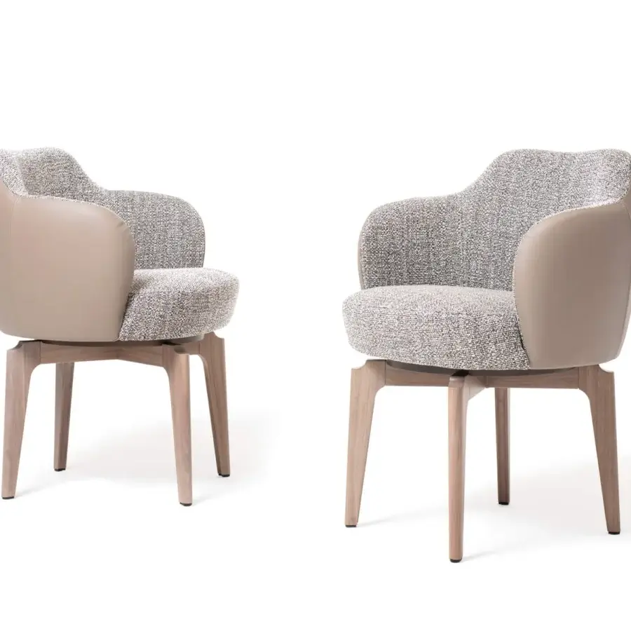 Superior Giorgetti Elisa armchair with graceful curves upholstered in speckled fabric and leather with walnut Canaletto swivel base
