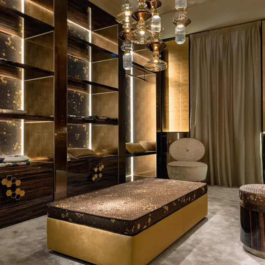 Lavish Sicis Hector ottoman crafted in Italy with warm brown and gold textile upholstery and a gilded base