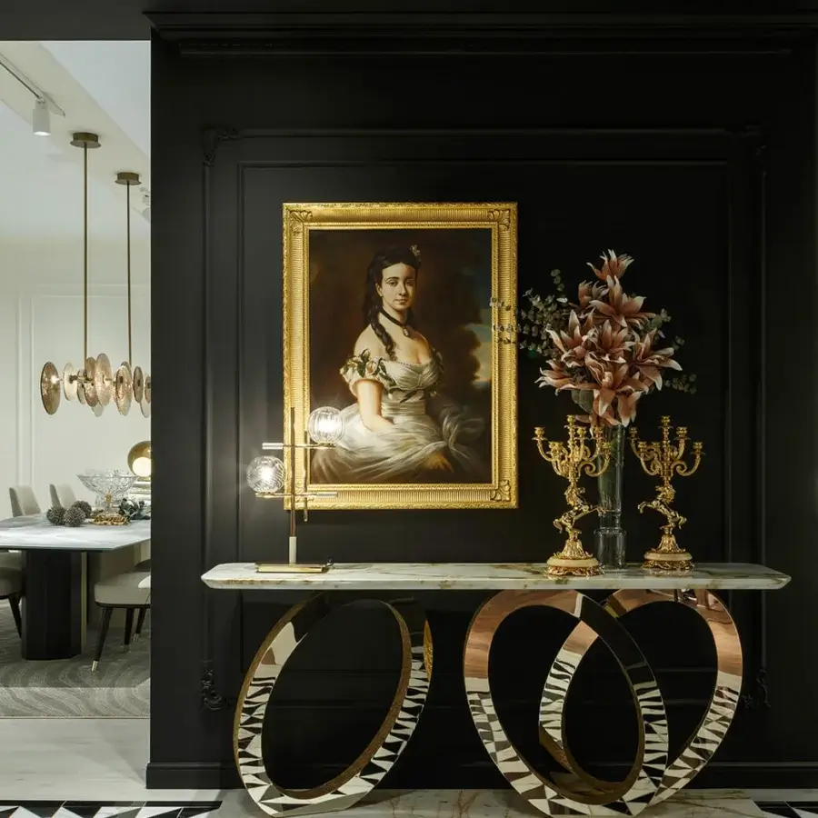 Lavish Sicis Fluxus console crafted with polished marble and flowing metallic structure in warm gold finish with mosaic detailing