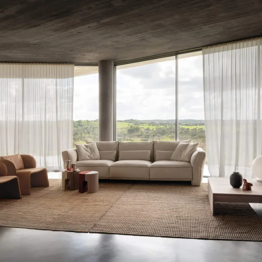 Captivating Cierre1972 Loden sofa with textured beige textile upholstery and elegant leather piping details