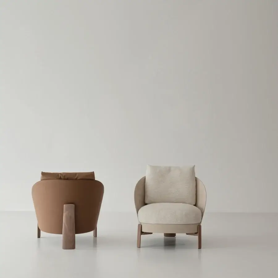 Distinctive Cierre1972 Catarina lounge chair with reddish-brown textile upholstery and satin-finish solid walnut legs