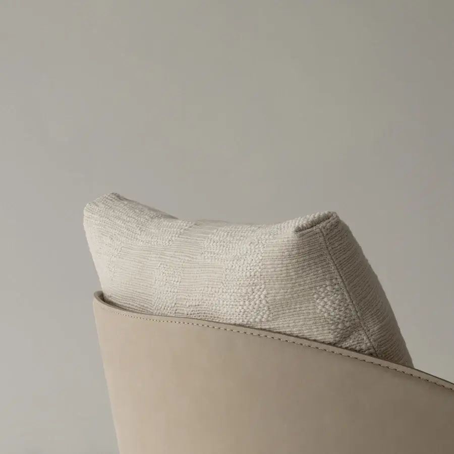 Superior Cierre1972 Catarina lounge chair with textured light-tan textile and gracefully curved leather shell built with walnut