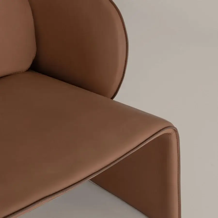 Superior Cierre1972 Knight lounge chair in medium brown leather with a smooth slightly glossy surface