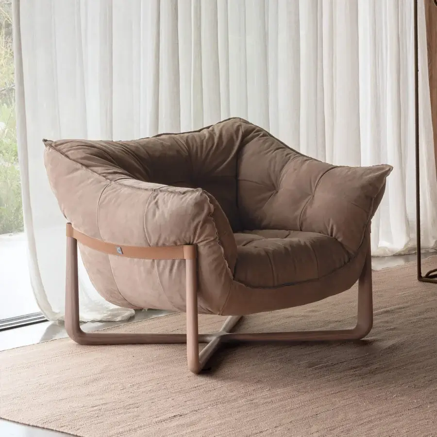 Distinctive Cierre1972 Donald lounge chair with warm brown textile upholstery and crossed metal base built with a coordinating wooden finish