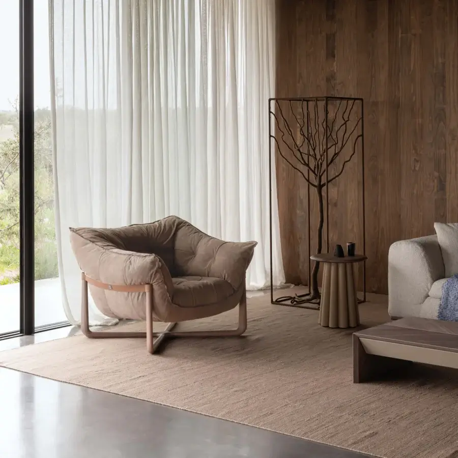 Superior Cierre1972 Donald lounge chair with taupe textile upholstery and sleek powder-coated metal frame crafted in Italy