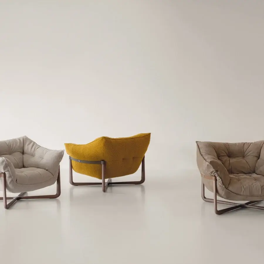 Exceptional Cierre1972 Donald lounge chair in warm brown quilted textile with satin-finish bent wood base
