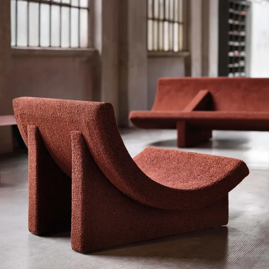 Exceptional Acerbis Trench lounge chair in textured terracotta upholstery with a flowing sculptural form crafted in Italy