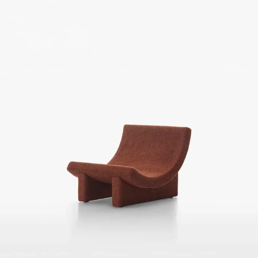 Distinguished Acerbis Trench lounge chair in reddish-brown woven fabric with gently sloping, fluid lines and sculpted form