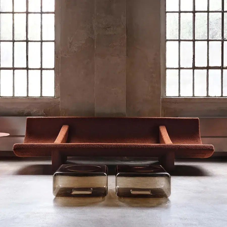 Distinguished Acerbis Trench sofa with a fluid curve and reddish-brown textured matte textile upholstery built with a dark-toned wood base