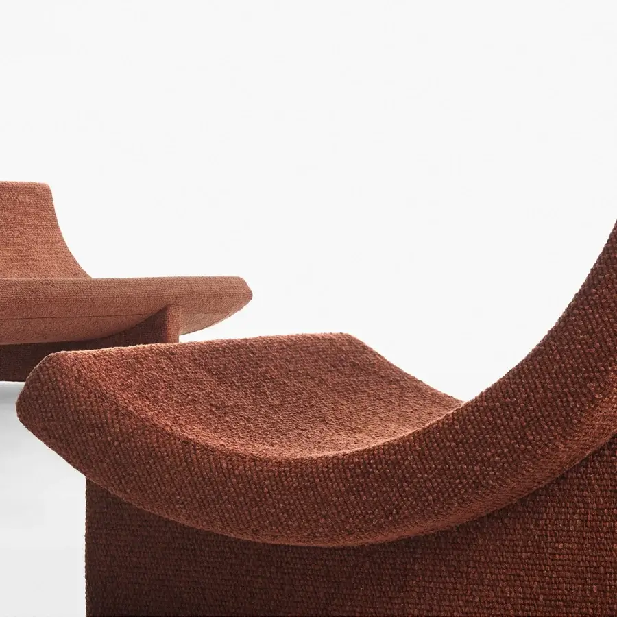 Superior Acerbis Trench sofa with sculpted form upholstered in warm terracotta textured textile and matte finish
