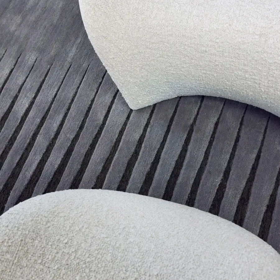 Elegant Giorgetti Eva lounge chair with shiny lacquered rigid polyurethane and light neutral textile upholstery