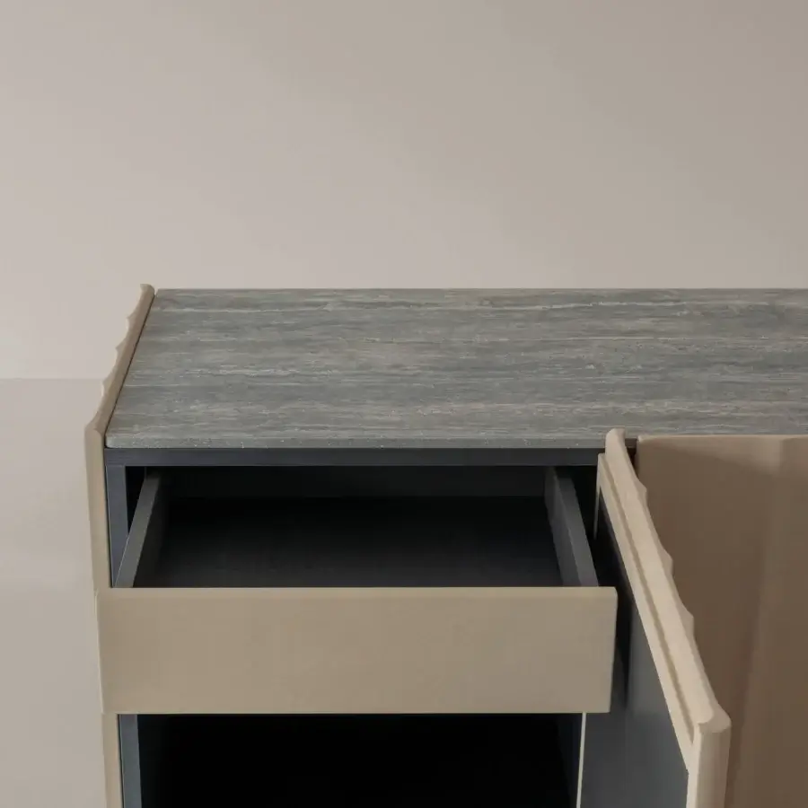 Distinguished Cierre1972 Dune sideboard crafted in Italy with textured stone and matte beige wood finish exhibiting molded doors