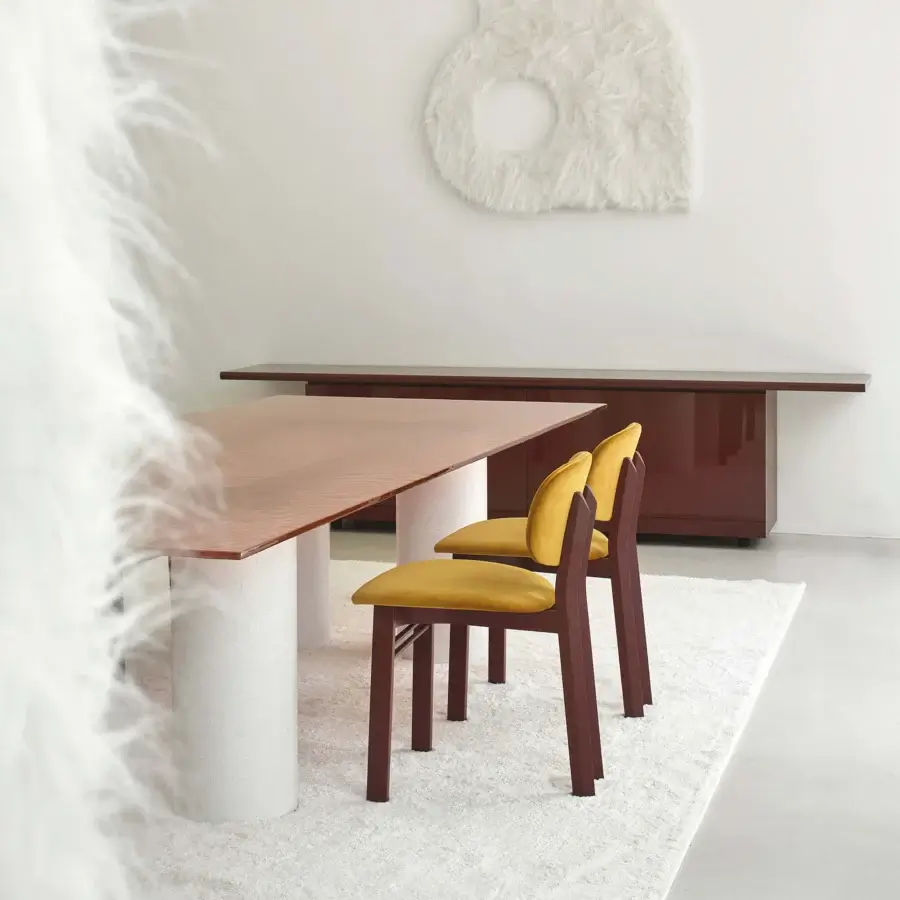 Distinguished Acerbis Serenissimo table with warm medium-brown wood tabletop and speckled off-white composite cylindrical bases crafted in Italy