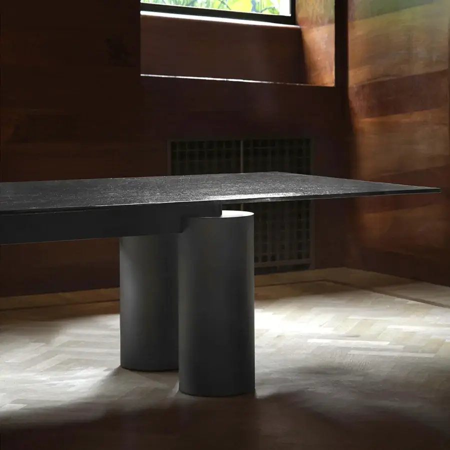 Distinguished Acerbis Serenissimo table with Marquinia Black marble tabletop and sandblasted blown glass base crafted with encaustic finish