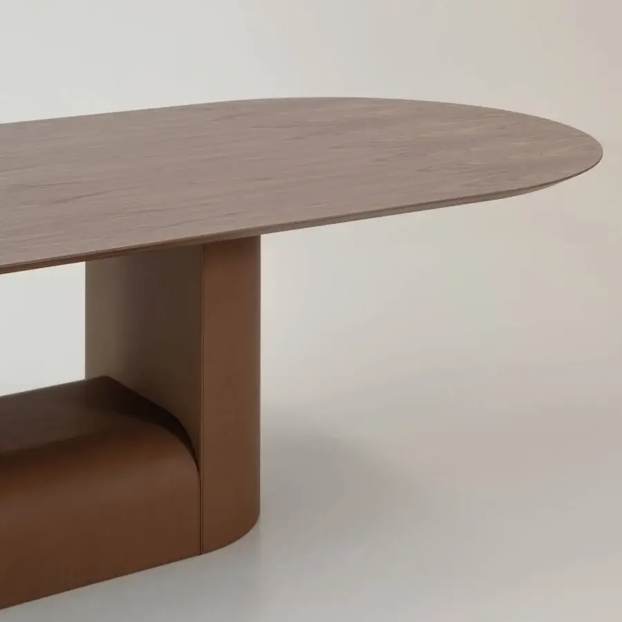 Exceptional Cierre1972 Samoa table crafted with a medium-brown wood tabletop and warm tan geometrically-shaped leather base with a satin finish