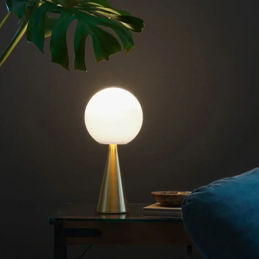 Exclusive FontanaArte Bilia table lamp with a white blown glass sphere and polished golden metal conical base