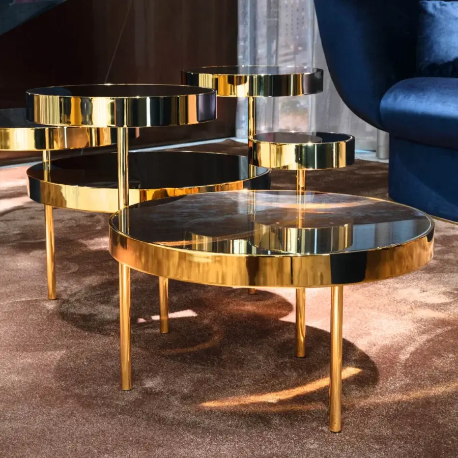 Stunning Sicis Orbital coffee table with gently overlapping smoky mirror tops and warm gold reflective metal structure