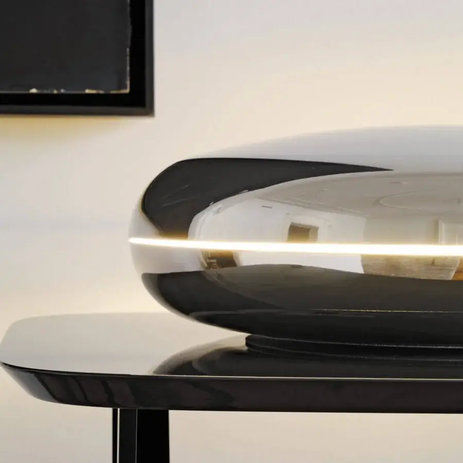 Exceptional FontanaArte Loop table lamp in glossy metal with deep black finish and unique looped form