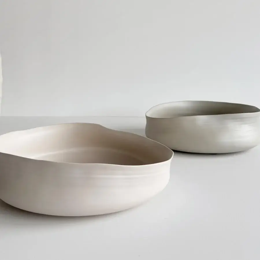 Distinguished Rina Menardi Cenote vessel set crafted from baked clay with organic curved forms and a muted off-white palette