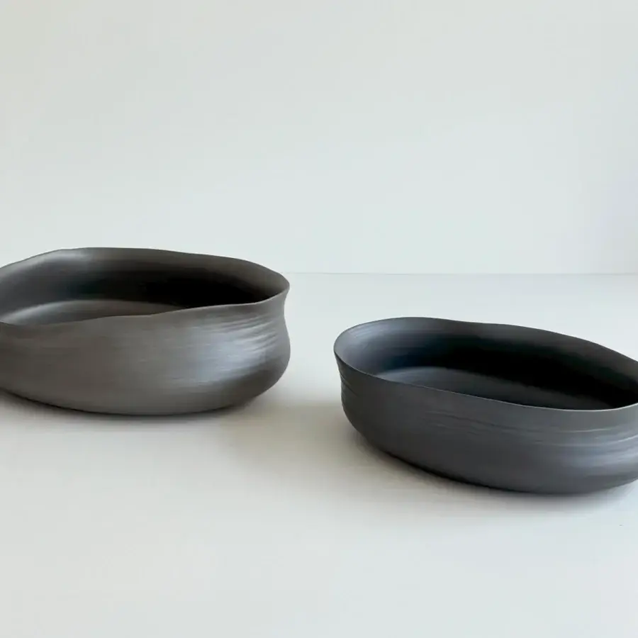 Exceptional Rina Menardi Cenote vessel set handcrafted in baked clay with a matte dark gray finish