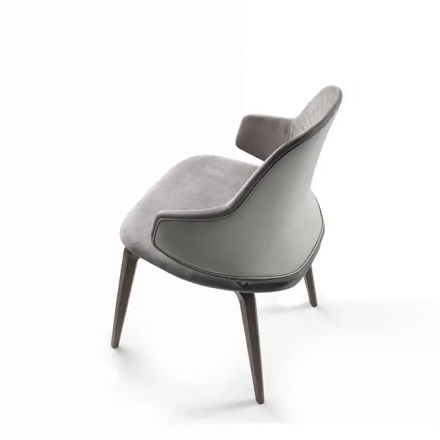 Distinguished Reflex Vela chair with Canaletto walnut base and luxurious grey textile upholstery exhibiting quilted detailing